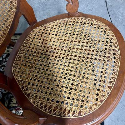 Carved and caned rocking chair