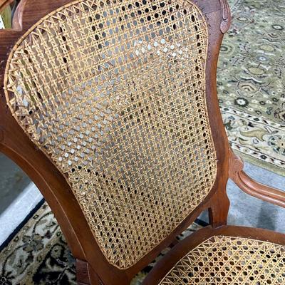 Carved and caned rocking chair
