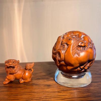 Chinese carved sphere and foo dog