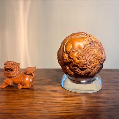 Chinese carved sphere and foo dog
