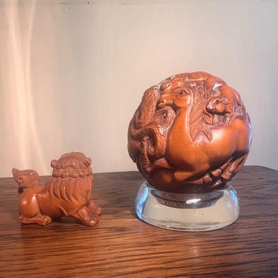Chinese carved sphere and foo dog