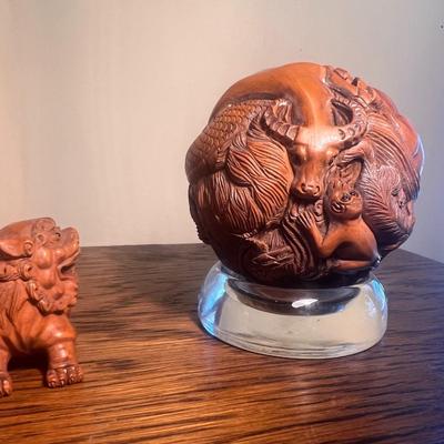 Chinese carved sphere and foo dog