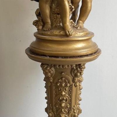 Large Gilt Coated Cherubs on a Stand