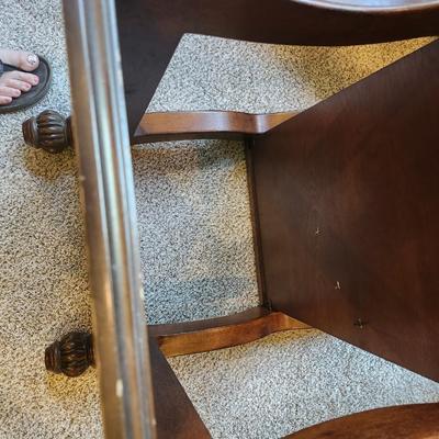 Brown furniture coffee table and two end tables.