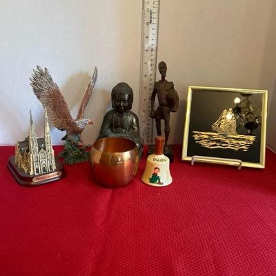 Sale Photo Thumbnail #15: Various home decor.. Kafka screened etching, brass Buddha, plastic eagle, wooden carved figurine