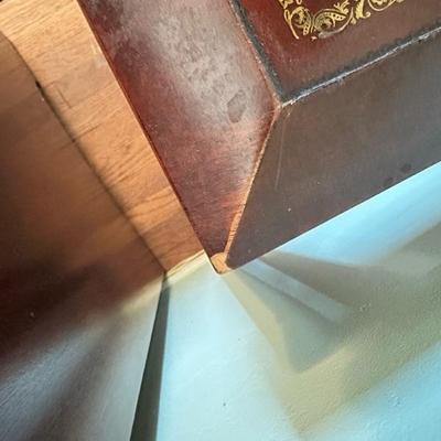 Sale Photo Thumbnail #112: Leather top nesting table set of two larger table 26” x 16” larger table has leather top smaller table has wood top