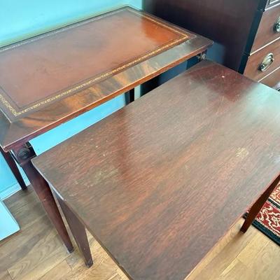 Sale Photo Thumbnail #118: Leather top nesting table set of two larger table 26” x 16” larger table has leather top smaller table has wood top