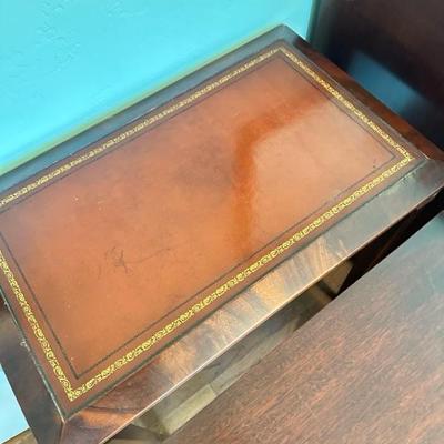 Sale Photo Thumbnail #117: Leather top nesting table set of two larger table 26” x 16” larger table has leather top smaller table has wood top