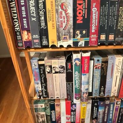 Sale Photo Thumbnail #167: Media rack with a variety of VHS and DVDs 22 inches wide 47 inches tall