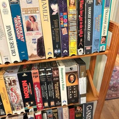 Sale Photo Thumbnail #168: Media rack with a variety of VHS and DVDs 22 inches wide 47 inches tall