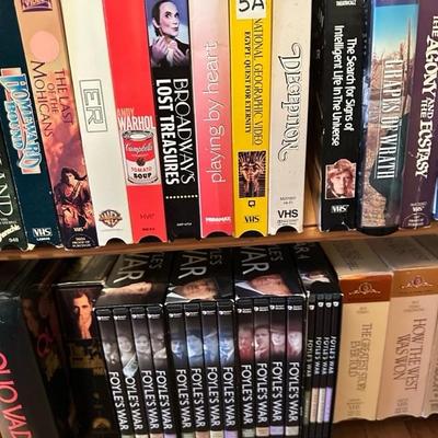 Sale Photo Thumbnail #162: Media rack with a variety of VHS and DVDs 22 inches wide 47 inches tall