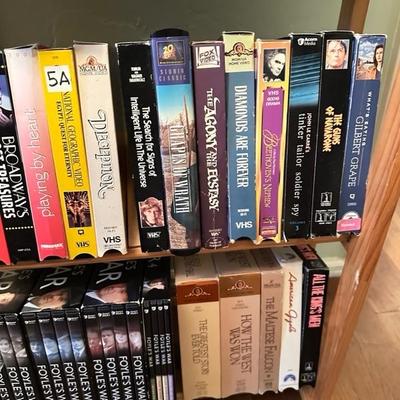 Sale Photo Thumbnail #165: Media rack with a variety of VHS and DVDs 22 inches wide 47 inches tall