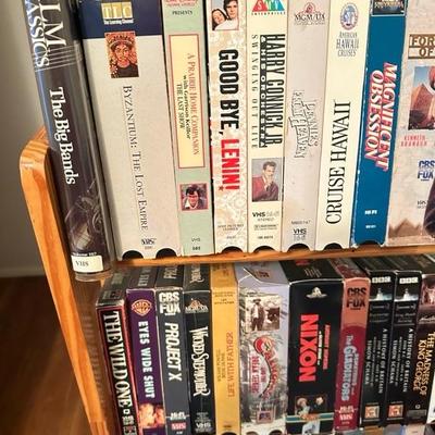 Sale Photo Thumbnail #169: Media rack with a variety of VHS and DVDs 22 inches wide 47 inches tall