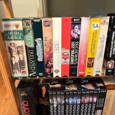 Sale Photo Thumbnail #163: Media rack with a variety of VHS and DVDs 22 inches wide 47 inches tall