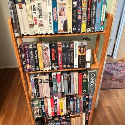 Sale Photo Thumbnail #164: Media rack with a variety of VHS and DVDs 22 inches wide 47 inches tall