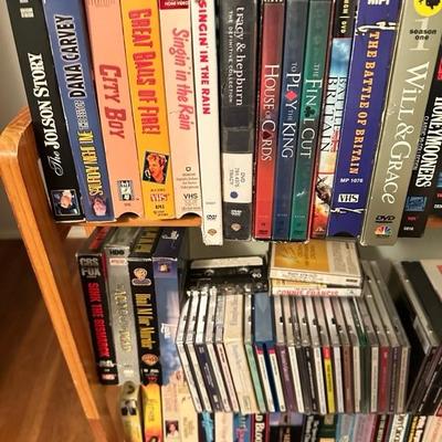 Sale Photo Thumbnail #176: Media rack with a variety of VHS and DVDs 22 inches wide 47 inches tall

Rack needs to be tightened 