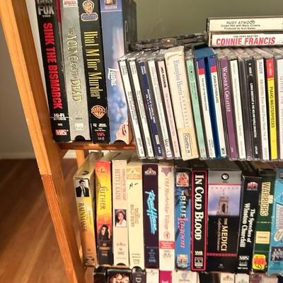Sale Photo Thumbnail #173: Media rack with a variety of VHS and DVDs 22 inches wide 47 inches tall

Rack needs to be tightened 