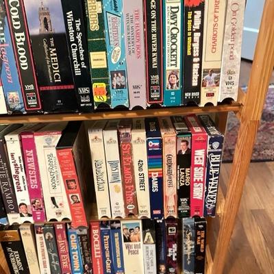 Sale Photo Thumbnail #171: Media rack with a variety of VHS and DVDs 22 inches wide 47 inches tall

Rack needs to be tightened 