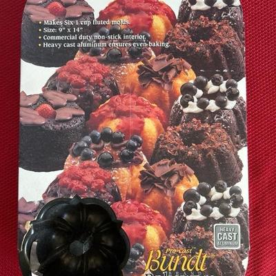 Sale Photo Thumbnail #342: Misc kitchen items… cookware lids, paper mache wall decor, scales, mugs, muffin pan