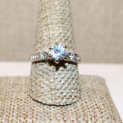 Size 10 Highrise Clear Stone Ring with Very Ornate Setting with a Silver Tone Band (3.8g)