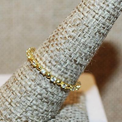 Size 6 Delicate All Infinity Styled Ring with Tiny Round Clear Stones Separated by Half Globe Accents on a Gold Tone Band (1.0g)