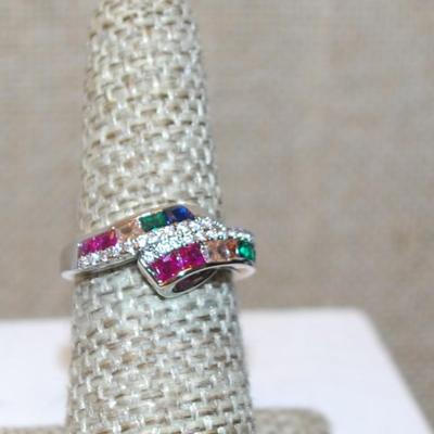 Size 6 Overlap Style Ring with Red, Green, Blue & Champagne Colored Stones on a Silver Tone Band (3.5g)
