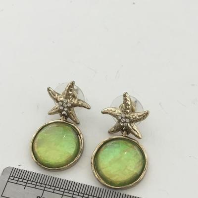 Gold tone starfish dangle earrings