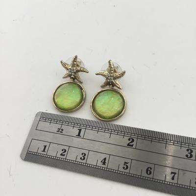 Gold tone starfish dangle earrings