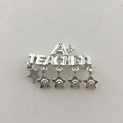 AAJ marked a plus teacher pin