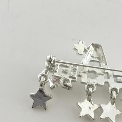 AAJ marked a plus teacher pin