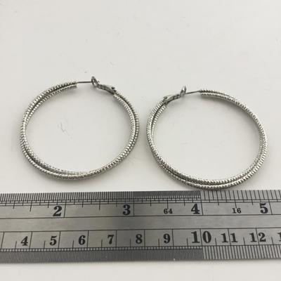 Silver tone hoop earrings
