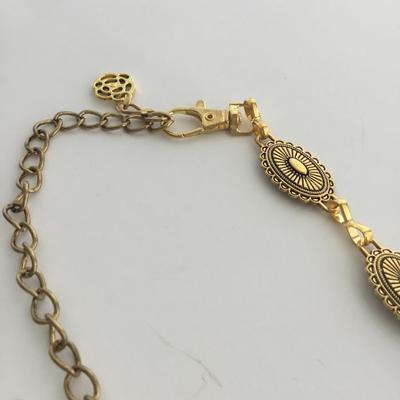 Gold tone adjustable belt