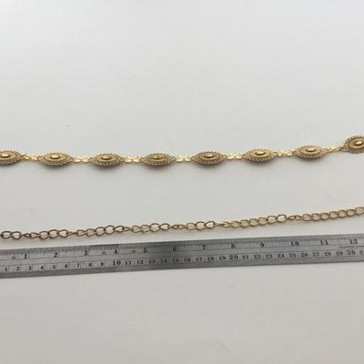 Gold tone adjustable belt