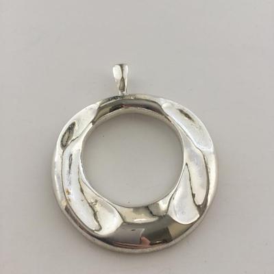 Silver tone necklace pendant