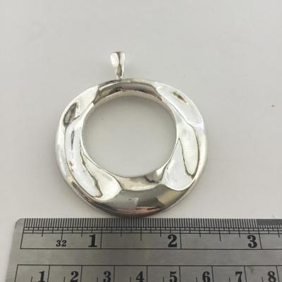 Silver tone necklace pendant