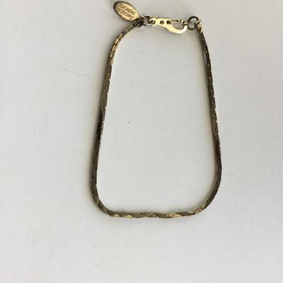 American showcase marked gold tone fashion bracelet
