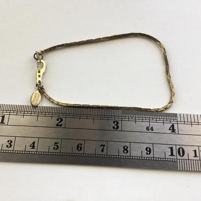 American showcase marked gold tone fashion bracelet