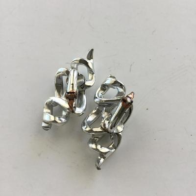 Silver tone vintage clip on swirl earrings