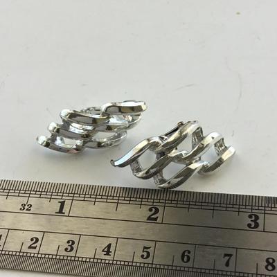 Silver tone vintage clip on swirl earrings