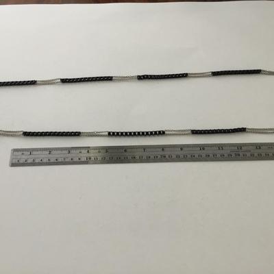 Black and silver tone long necklace
