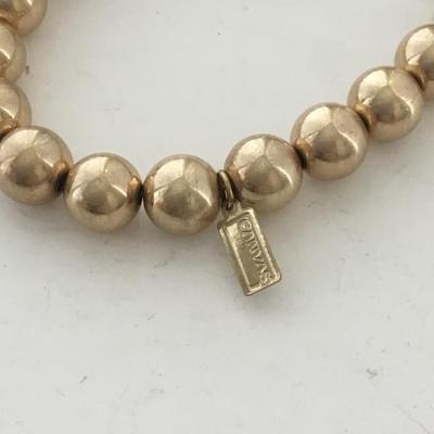 Marked gold tone beaded stretchy bracelet