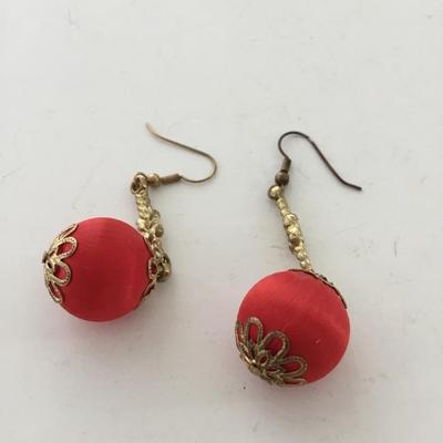Gold tone red dangle earrings