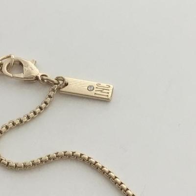 IMC marked gold tone black tassel three heart necklace