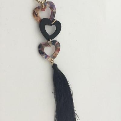 IMC marked gold tone black tassel three heart necklace