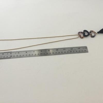 IMC marked gold tone black tassel three heart necklace
