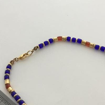 Gold tone blue and orange fashion necklace