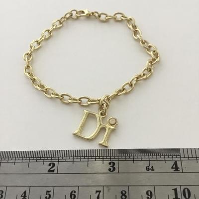 Gold tone DI charm bracelet