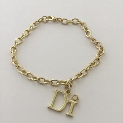 Gold tone DI charm bracelet