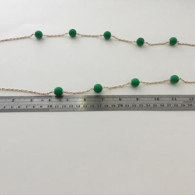 Gold tone green fashion necklace
