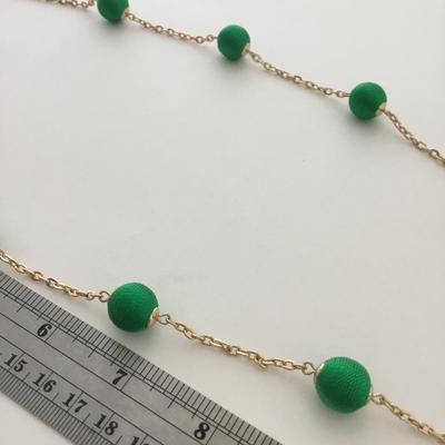 Gold tone green fashion necklace